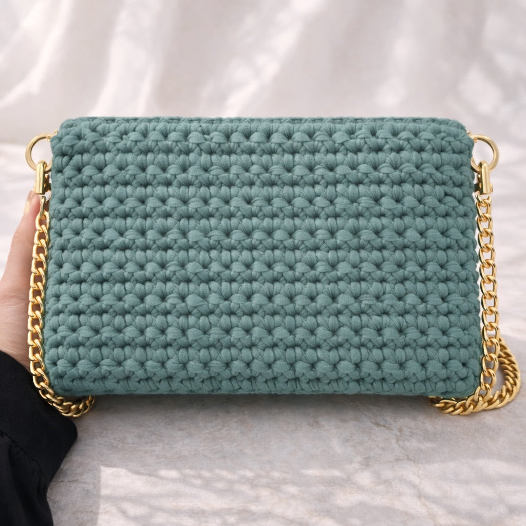Icon 02 — Bolso texturizado con cadena
